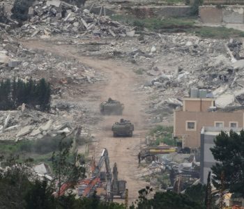 Israeli army vehicles and bulldozers operate in southern Lebanon, as seen from northern Israel, Wednesday, April 15, 2026. (AP Photo/Ariel Schalit)